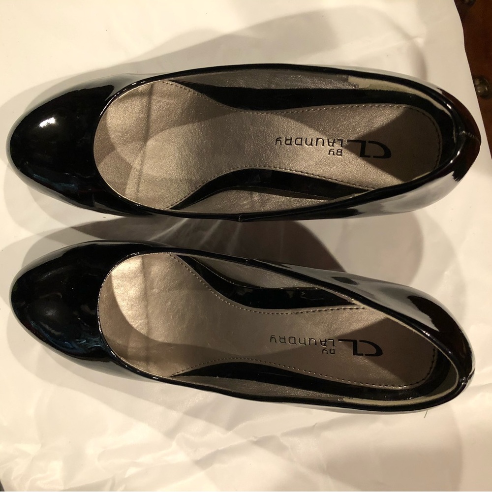 Black patent leather wedge pumps
